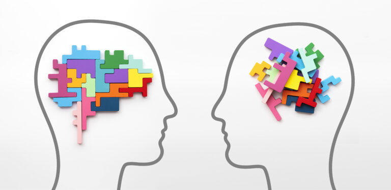 Right and left sides of the brain concept. Puzzle pieces in the shape of a brain.
