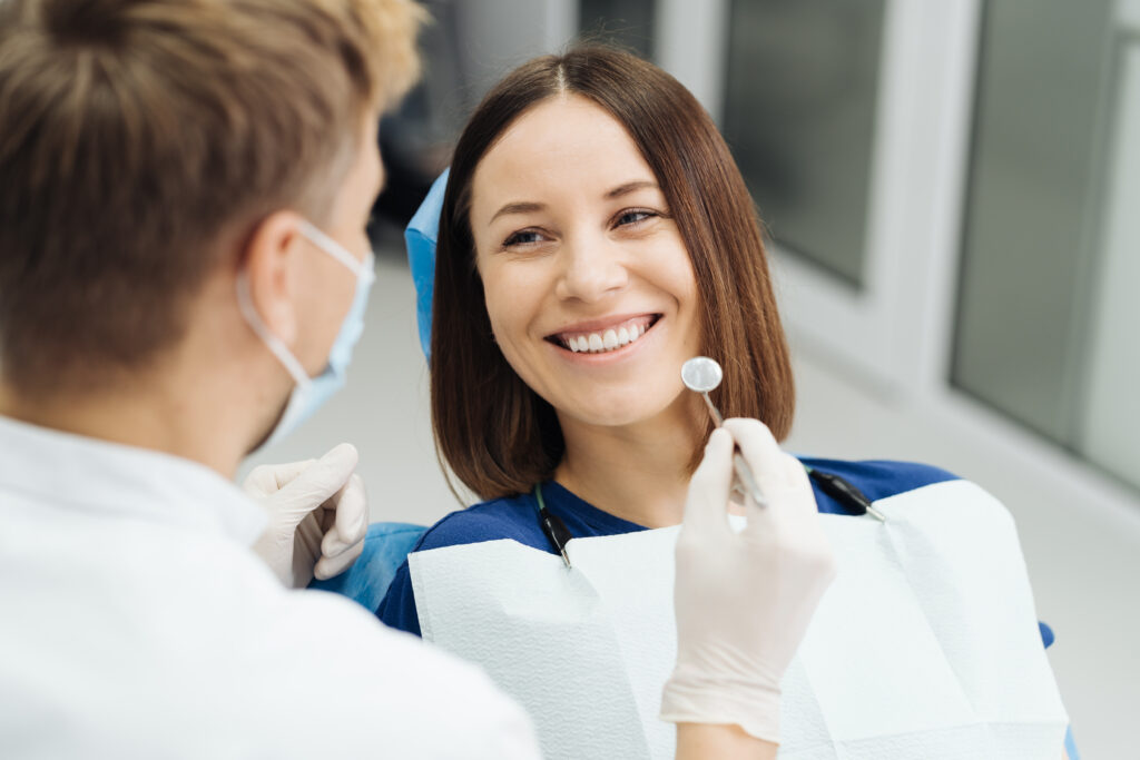 Shop - male professional dentist with gloves mask discuss what treatment will look like patient s teeth - Greek List