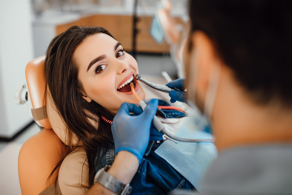 Shop - young female patient visiting dentist office - Greek List